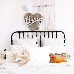 pillows on bed beside headboard
