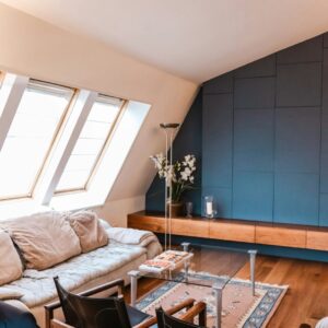 beige 3-seat sofa near the window