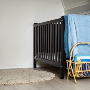 blue textile on brown wooden chair